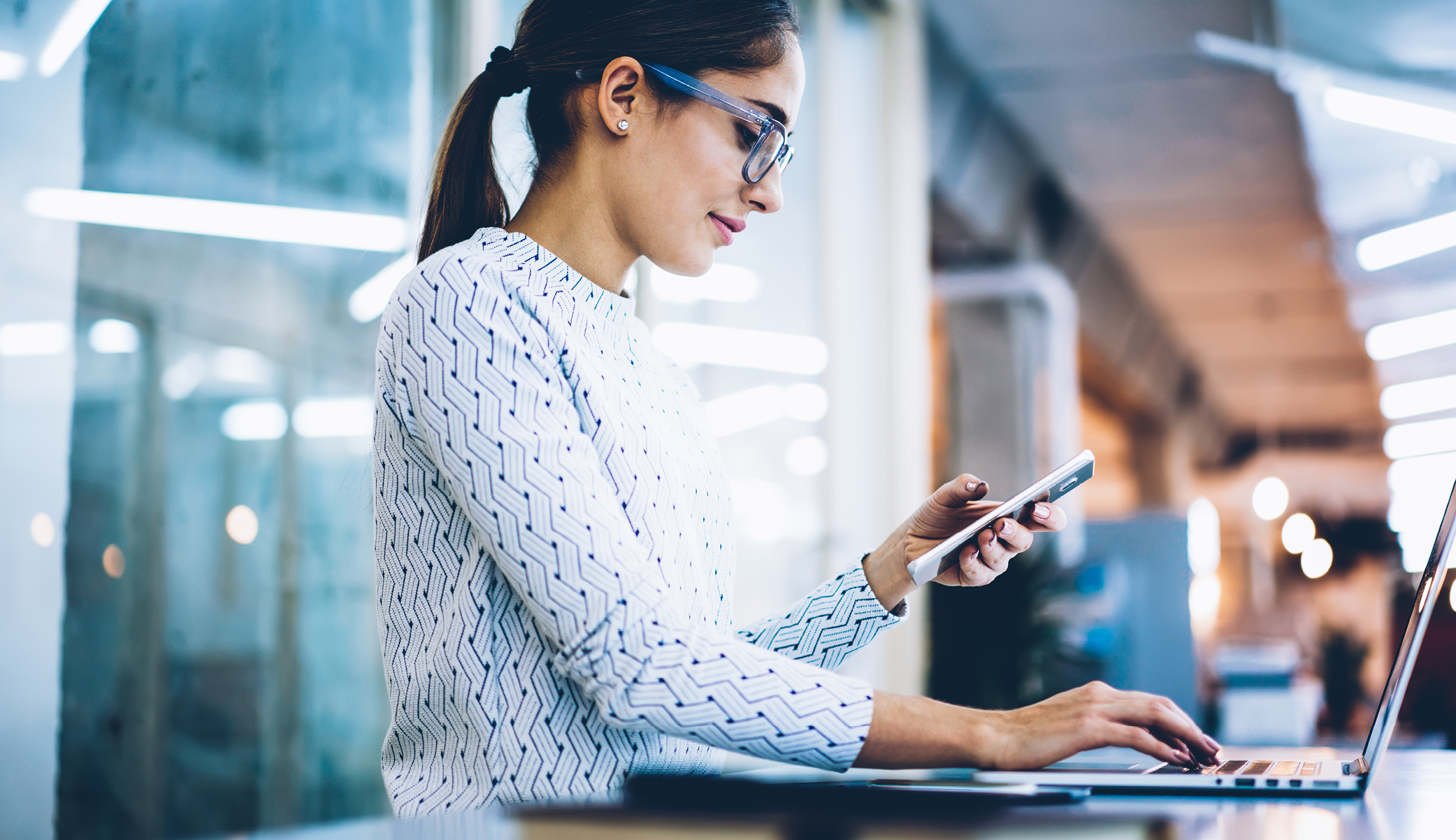 woman on phone and computer
