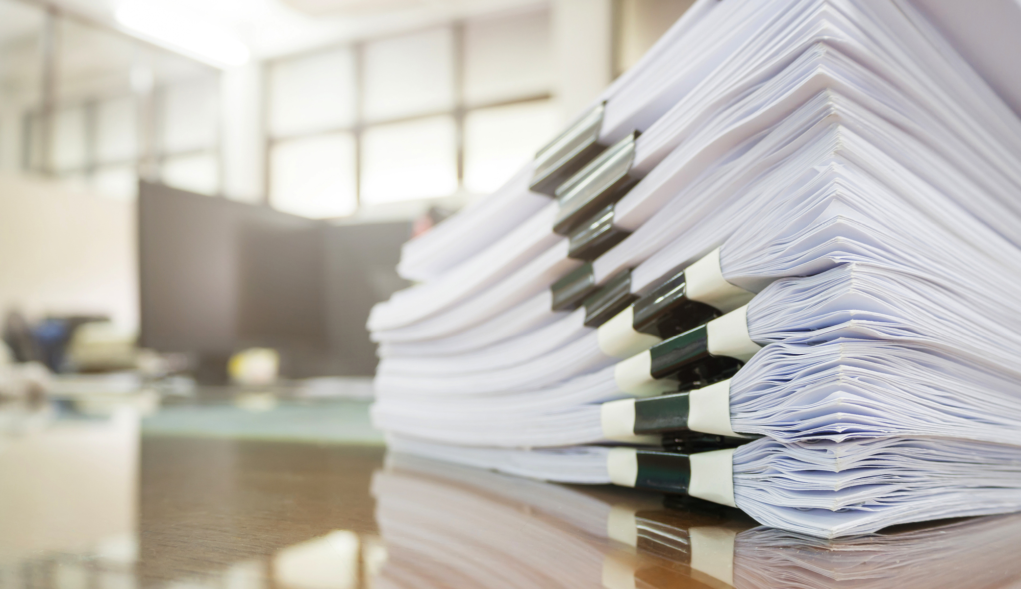 stack of papers on a desk